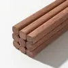 Venta al por mayor de fabricantes palillos para hot pot extendidos sin pintar y encerados palillos de madera maciza palillos de madera de ala de pollo vajilla de madera de sándalo rojo