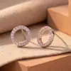 Bestseller transfronterizo: sencillos, exquisitos, compactos, circulares, circonita rosa de nicho, modernos, versátiles, pendientes de diseñador para mujer de alta gama