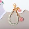 Llavero de Borla de Flor de Resina de Moda Cadena para Teléfono Móvil con Cuentas de Perlas Antiperdida Colgante para Bolso/Estuche para Audífonos de Niña