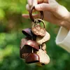 Cascabel Campana de Mano Carrillón Colgante de Bolsa Hecho a Mano Rayo de Sonido Cascabel Colgante Fruta Negra Indonesia Cáscara Fábrica Venta al por Mayor