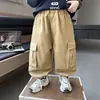 Calças cargo masculinas com múltiplos bolsos, novas calças casuais versáteis de corte solto para primavera e outono para crianças, calças estilosas e da moda para crianças pequenas