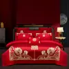 Juego de ropa de cama de lujo estilo chino, hecho de algodón 100% de fibra larga, un juego de cuatro piezas que incluye una sábana y una funda de edredón de algodón puro rojo, perfecto para la alcoba de una recién casada.