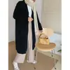 Cárdigan de punto suelto suave y ceroso de estilo perezoso de longitud media abrigo con sentido de diseño para mujer primavera otoño