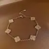 Pulsera Trenzada Hebilla de Herradura Redonda de Circonita Roja Europea y Americana Diseño de Nicho Pulsera Exquisita de Gama Alta para Mujer