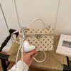 Bolso pequeño cuadrado de lunares de moda transfronterizo para mujer 2026 verano nuevo diseño de nicho bolso de mano de un solo hombro bolso cruzado para mujer