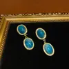 Estilo Occidental Chapado en Cobre Antiguo con Oro de 18 Quilates para Crear un Color Dorado Vintage, Combinado con Pendientes Colgantes Dobles Redondos Incrustados con Degradado de Color Tinta