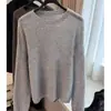 Suéter de tricô cinza-diamante com gola redonda e mangas compridas em estilo casual para mulheres, novo modelo outono 2026, elegante e que afina a silhueta para o trabalho