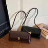 Bolso Retro Cruzado de un Solo Hombro Bolso de Mano de Alta Gama para el Trabajo Bolso de Moda de Nicho Bolso Baguette para Debajo del Brazo Bolso de Mujer al por Mayor Personalizado