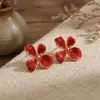 Pendientes de Flor de Esmalte Rayados Elegantes de Lujo Ligero de Venta Caliente Transfronteriza con un Toque de Alta Gama, Pendientes Florales de Acero Inoxidable Modernos y Versátiles