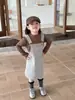 Nova Roupa Infantil Estilo Coreano Outono 2026: Vestido Estiloso de Suspensório para Meninas, Vestido Longo de Manga Longa Slim-Fit com Estampa de Leopardo