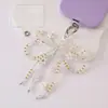 Cadena para teléfono de cristal con lazo incrustado de diamantes de alta gama, minimalista y lujosa, con un diseño fresco y delicado, que sirve como correa para teléfono, accesorio para la muñeca o adorno colgante