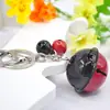 Lindo Llavero de Campana de Moda Colgante de Campana de Metal de Dos Tonos Accesorios para Colgar en Bolsos de Mujer y Coches