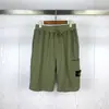 Braçadeira de Bússola de Pedra Transfronteiriça Marca Tendência Europeia e Americana Bolso Grande Cor Sólida Casual Solta Calça de Cinco Pontas para Homens e Mulheres
