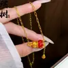 Tienda de Oro Mismo Estilo Collar de Calabaza de Cuatro Hojas Trituradas Chapado en Oro para Mujer, Versátil y Elegante, Joyería de Cadena para Clavícula de Mariposa con Forma de Corazón