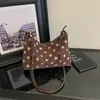 Bolso de un solo hombro de lunares para mujer 2026 nuevo estilo perezoso retro bolso de axila versátil gamuza felpa bolso cruzado retro otoño e invierno
