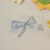 Exquisito nuevo accesorio para el cabello de bebé estilo coreano y japonés, completamente cubierto de tela, no daña el cabello, pinza para el fleco lateral de lazo para niñas, adorno para el cabello
