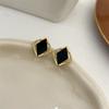 Exquisitos pendientes de diamantes negros para mujer, nuevos pendientes de estilo frío, diseño de nicho, luz explosiva, pendientes de lujo de alta gama.