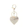 Llavero de corazón de diamantes completos coreano aleación de zinc amantes amor llavero de coche de aleación de zinc strass colgante para bolso de mujer venta al por mayor