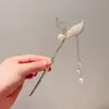 Grampo de cabelo de flor de magnólia do mesmo estilo de veado branco, grampo de cabelo de borla de super fada, estilo antigo, grampo de cabelo elegante de hanfu, grampo de cabelo de passo, acessório de cabeça