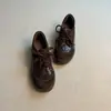 Zapatos negros únicos para mujer con suelas gruesas, nuevo modelo popular para primavera y otoño, zapatillas de entrenamiento casuales alemanas que aumentan la altura, zapatos de papá, zapatos casuales con suela gruesa