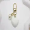 Lindo Colgante Llavero Corazón de Resina Multicolor Perla Versátil Femenino Colgante Corazón de Durazno Accesorio para Bolso Teléfono