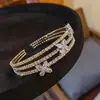 Pulsera Abierta Metálica con Flor de Cruz Incrustada de Diamantes Europeos y Americanos Multicapa Moda Elegante Estilosa de Nicho Joyería de Mano de Alta Gama para Mujeres