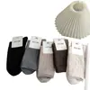 Calcetines estilo Meilad para mujer para otoño e invierno, con diseño de hilo de puntos, color liso, longitud hasta la mitad de la pantorrilla, versátiles, gris retro, tonos cálidos y estilo simple