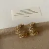 Pendientes Minimalistas de Flor Hueca de Metal para Mujer Dulce Nicho Temperamento Moda Tendencia Versátiles Accesorios de Pendientes
