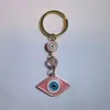 Colgante de Serie Ojo de Diablo Transfronterizo Europeo y Americano Colgante de Llavero de Joyería de Animales Ojo de Hueso con Goteo de Aceite Accesorios de Aleación para Mujeres