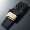 Calças de outono e inverno novas calças de plumas masculinas espessas moda casual à prova de vento à prova de frio à prova de neve calças de outono quentes masculinas plus size calças de algodão