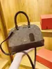 Bolso de Hombro Vintage Nueva Moda Otoño/Invierno 2026 para Mujer con Monograma Bolso Versátil Estilo Europeo y Americano Forma de Concha Personalidad Única