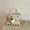 Bolso Tejido de Patchwork de Moda para Mujer 2026 Nuevo Bolso Cubo de Hombro Único y de Mano Versátil con Textura Bolso Cruzado de Moda