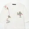 Comercio Exterior Transfronterizo Ropa de Mujer 2026 Verano Nuevo Producto Estilo Europeo y Americano Moda Camiseta de Manga Corta Bordada con Flores Cuello Redondo 1165037