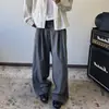 Pantalones casuales de traje a rayas con botones para hombre y mujer, nuevos de otoño vintage versátiles holgados que estilizan con caída y pierna ancha