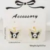 Aretes de Hebilla de Oreja Cobre Incrustado Circonita Ojos de Gota de Aceite Suministro de Comercio Exterior Joyería de Perforación de Moda Anillo de Hélice de Mariposa Perno de Oreja