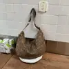 Bolso de lona con estampado de leopardo para mujer, nuevo modelo otoño/invierno 2026, bolso tipo dumpling de gran capacidad para el hombro para la escuela y el trabajo, bolso de hombro y cruzado