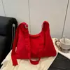 Bolsa Feminina Listrada em Cores Contrastantes 2025 Nova Bolsa de Ombro com Pingente para o Dia a Dia Estilo Coreano Lona Casual Bolsa de Ombro Transversal