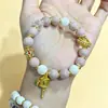 Producto genuino de zona escénica: Cuentas de porcelana color gris macarrón-rosa con diseño de corazón-sutra blanco, pulsera para mujer, cuentas de vidrio color ceniza de incienso, pulsera auspiciosa con pan de oro, cuentas de vidrio