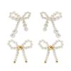 Joyas transfronterizas europeas y americanas Pendientes de lazo pendientes de botón de lazo estilo ins mariposa temperamento pendientes anudados de perla sintética para mujer