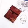 Muestra de pedido final se puede pedir bolsa de tela de brocado para regalo bolsa Wenwan estilo japonés bolsa de almacenamiento de joyas billetera plegable tela
