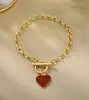 Conjunto de colar com pingente de coração, pulseira e brincos europeu e americano transfronteiriço com design de gota de óleo, joias versáteis de luxo leve para mulheres