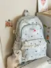 Mochila escolar para estudiantes de secundaria femeninas, mochila decorativa con adornos de encaje para niñas, bolsa ligera casual de doble hombro, protectora de la columna vertebral y reductora de carga