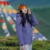 Chaqueta de montaña a prueba de viento e impermeable tres en uno de estándar nacional para hombres y mujeres, con plumón de ganso, forro polar y diseño de dos piezas, adecuada para su uso en Xizang