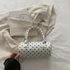 Bolso de lunares de nicho súper popular para mujer, nuevo y exquisito minibolso cruzado versátil 2026, bolso cilíndrico de mano más vendido