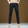 Pantalones casuales negros de tecnología de tres pruebas para hombre de otoño e invierno, pantalones largos de algodón elásticos holgados de pierna recta con forro polar