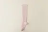 Calcetines de compresión deportivos de color sólido profesionales para correr maratones, yoga, ciclismo, adelgazamiento sin costuras y senderismo, longitud media-alta hasta la pantorrilla