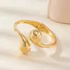 Explosiones transfronterizas nicho moda lujo metal viento forma de gota geométrico liso tamaño cruz pulsera joyería al por mayor