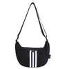 Bolso Cruzado de Lona Casual para Mujer 2025 Nuevo Bolso de Viaje Casual Ligero Almacenamiento Versátil Deportivo Nylon Dumpling Bag