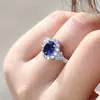 Joyería de explosiones de comercio exterior de alta gama Europa y Estados Unidos popular anillo de compromiso para dama circón azul de alta gama anillo de oro real al por mayor