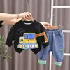 Versão coreana da nova coleção Primavera e Outono suéter de manga longa estilo ocidental com gola redonda e estampa de desenho animado conjunto casual de jeans fabricantes atacado
